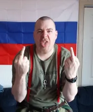 A young Hardy Lloyd reflecting his intelligence and cool demeanor.